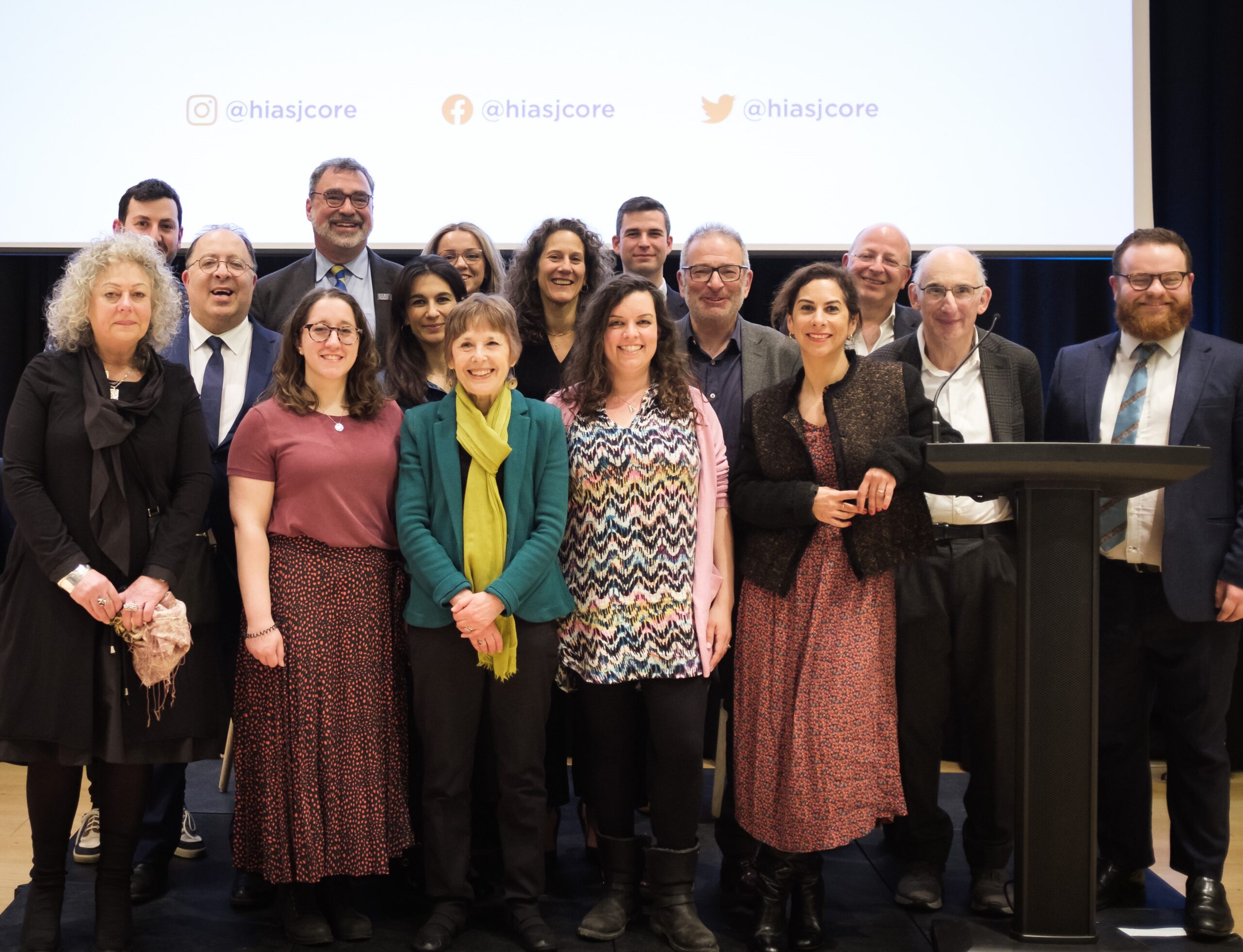 The HIAS+JCORE team stand on stage at JW3, at the launch event held in March 2023.